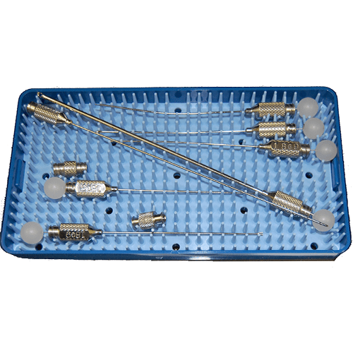 A tray with several surgical instruments on it.