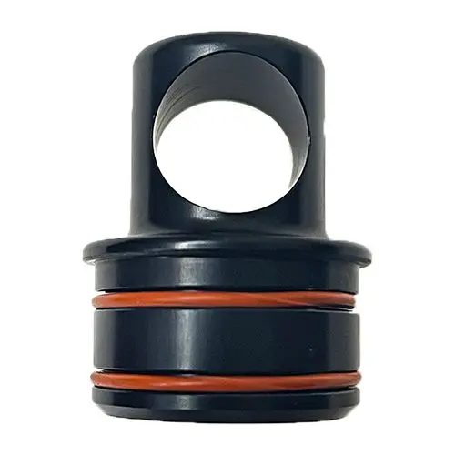 A black and orange ring is sitting on top of a white table.
