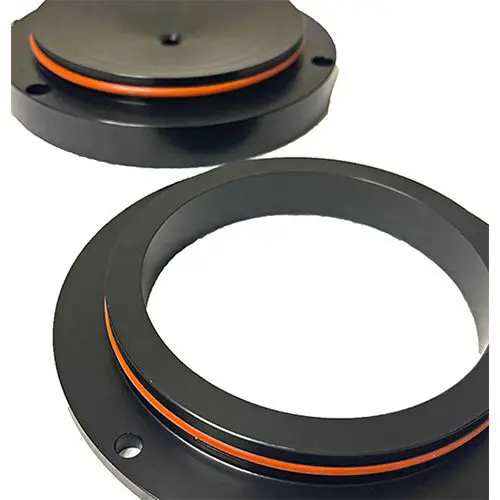 A black and orange ring is on top of the base.