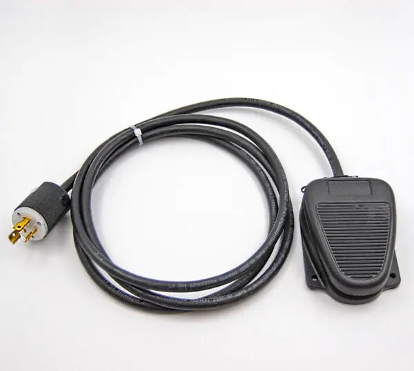 Black foot pedal with cord and plug.